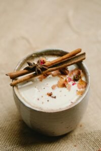 Delicious chai tea garnished with cinnamon sticks and star anise, offering a warm aromatic experience.